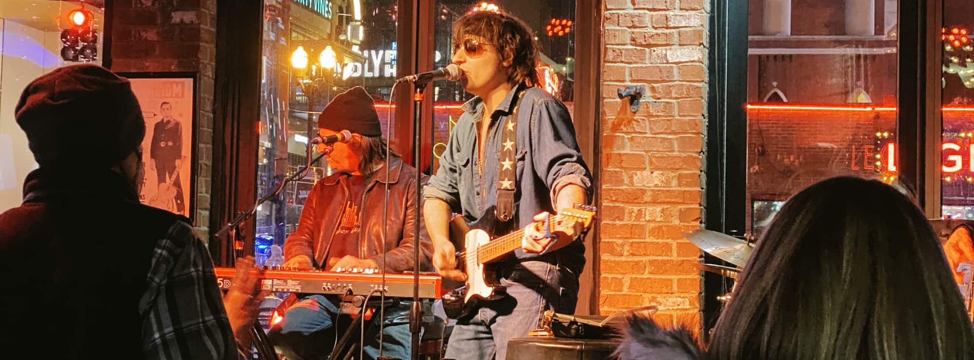 bar singer on guitar in San Antonio