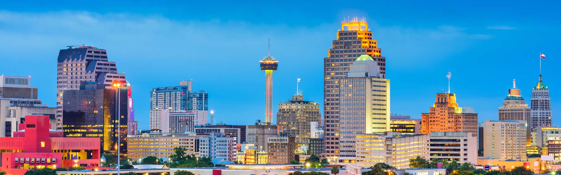 Neon color image of a band playing and people singing along
